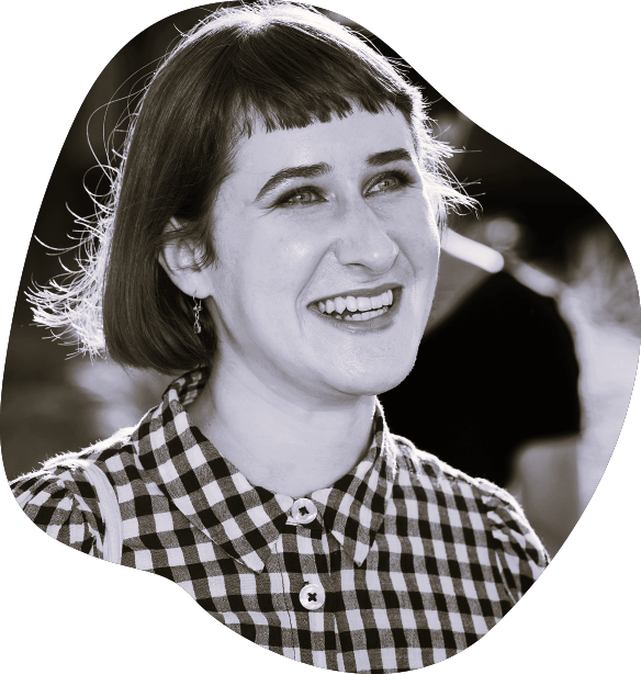 Peerclass Host The Peerclass host, Jasmin Allenspach, beams in a black-and-white photo, wearing a gingham shirt and a short bob with bangs